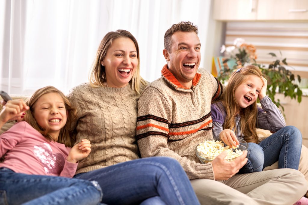 A family watching the film joyfully